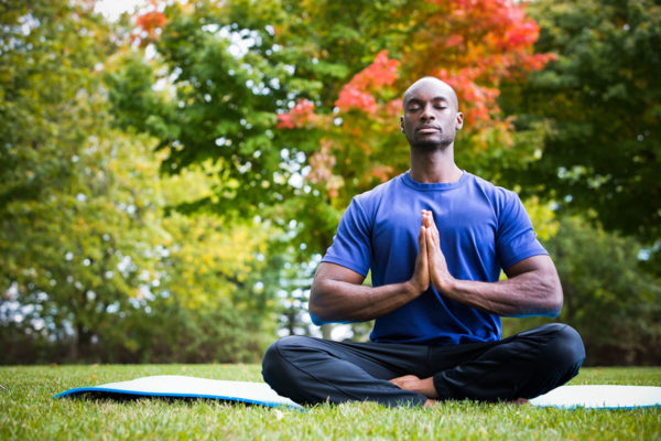 Person meditating in lotus position